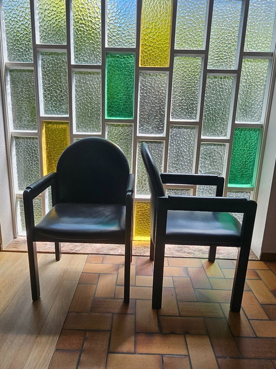 Image 1 of Ensemble de 6 (+2) chaises design Bulo – Cuir noir et bois – Années 1980