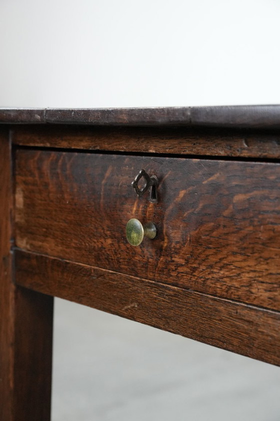 Image 1 of Antique English drop-leaf side/dining table made of oak from the 19th century with a drawer.