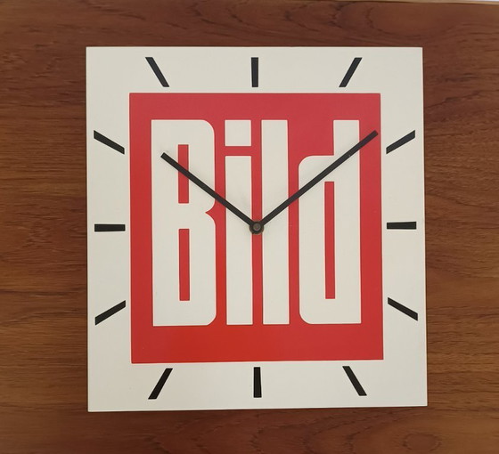 Image 1 of 1970s wall clock with advertising