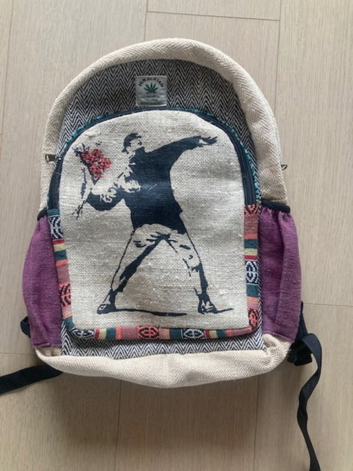 backpack Himalayan with Banksy-like "Flower trower" or "Love is in the air"