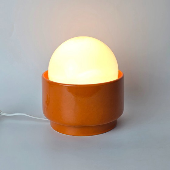 Image 1 of Vintage German ceramic lamp with a glass globe shade. Can be used as a wall lamp, table lamp, or sconce. Orange. 70s / retro