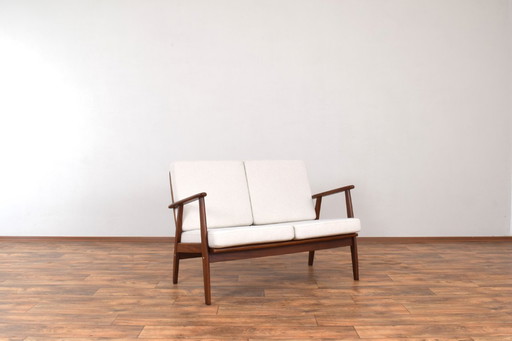 Zweisitzer-Sofa aus dänischem Teakholz aus der Mitte des 20. Jahrhunderts, 1960er Jahre.