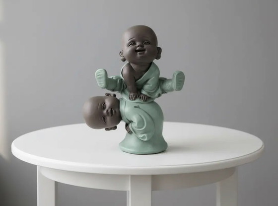 Image 1 of Estatuilla de Buda jugando al salto de la rana