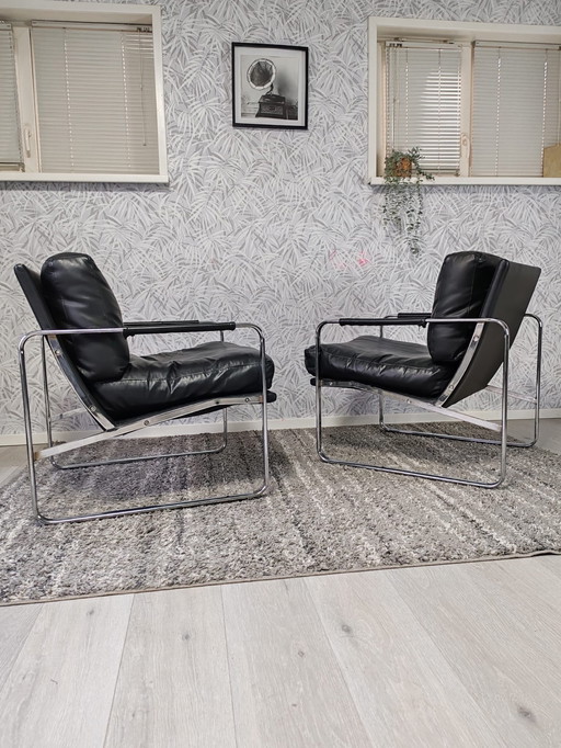 Set of 2 designer armchairs – black leather with chrome frame