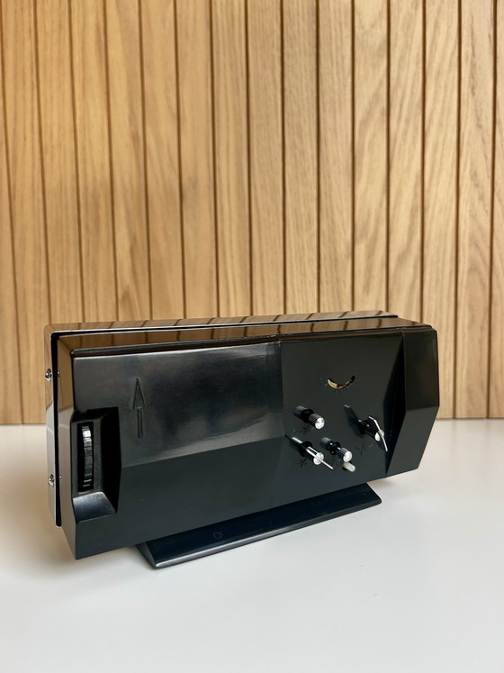 Image 1 of Vintage desk clock with flip date, made in Shanghai China.