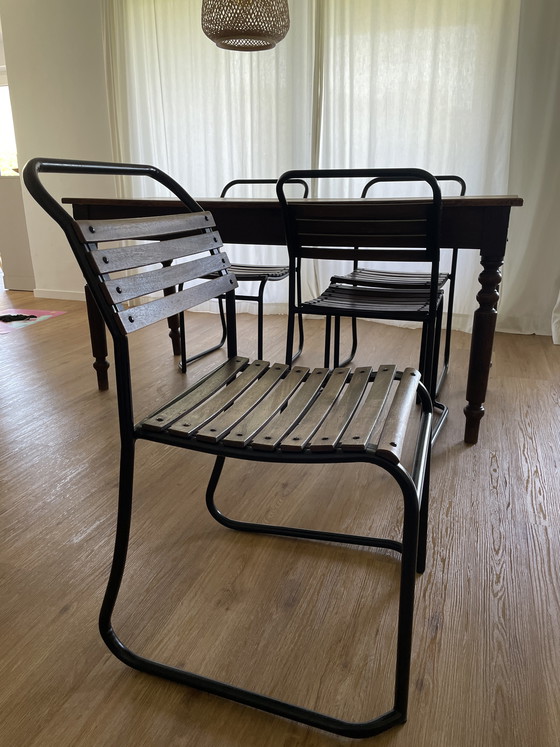 Image 1 of Solid wood dining table + 4 chairs - vintage / industrial style