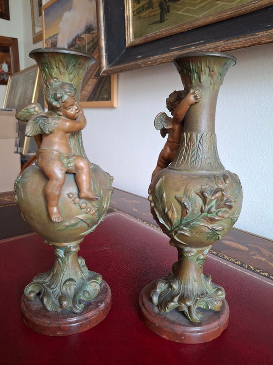 Image 1 of Pair of Art Nouveau spelter vases, circa 1900, with cherubs and a double patina