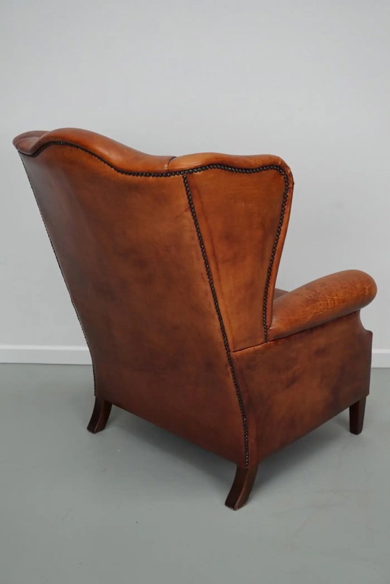 Image 1 of Vintage Nederlandse cognackleurige leren clubfauteuil met vleugelrug
