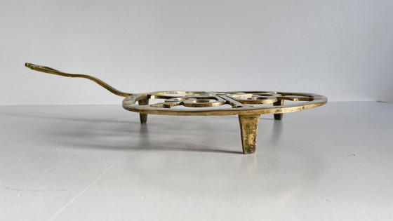 Image 1 of Solid brass trivet