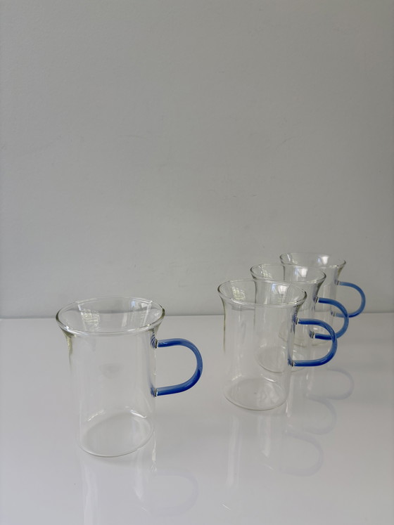 Image 1 of Set of four glass tea mugs with colored handles