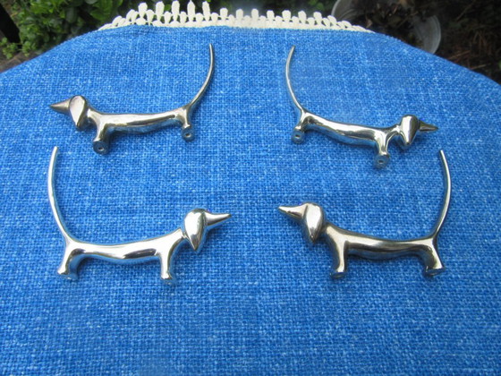 Image 1 of 4 Silver Plated Knife Rests Dachshund Dog Long Tail Blue Eyes vintage