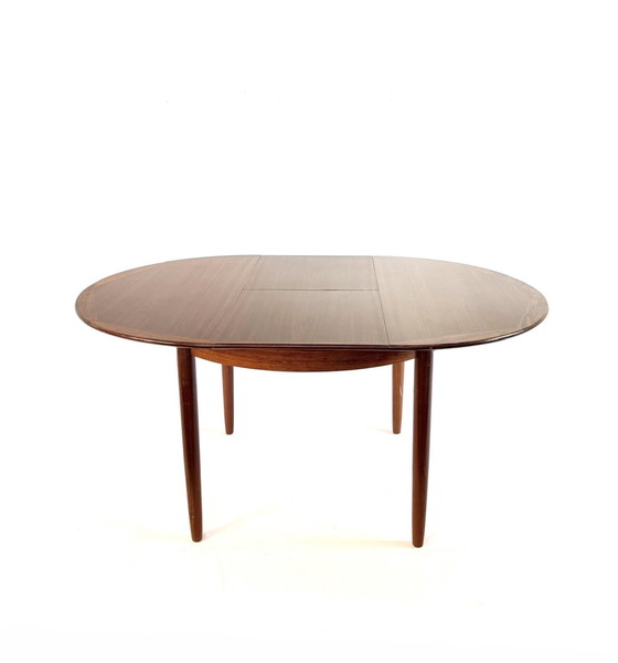 Image 1 of Vintage Rosewood extendable dining table '60
