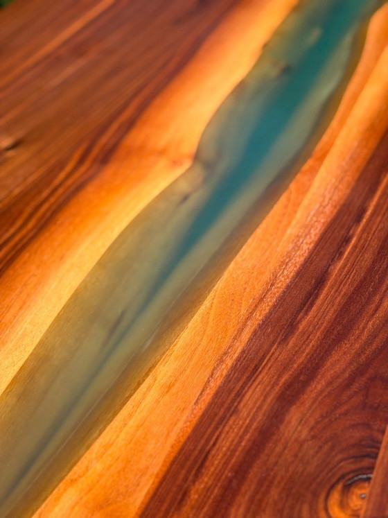 Image 1 of Dining table in American walnut and maple. Handcrafted solid wood extensions and drawers. Live edge for visual depth. Epoxy resi