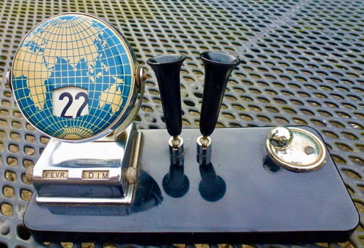 Vintage perpetual calendar with pen holders.