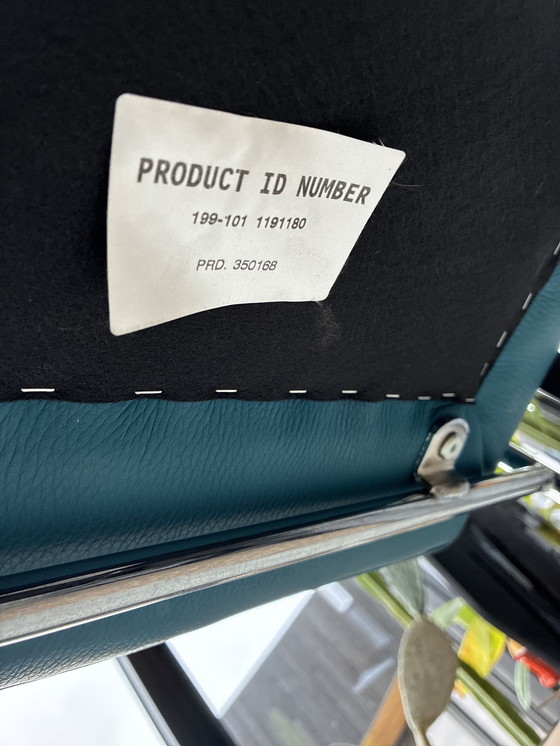 Image 1 of Leolux Talassa Fauteuil Senseo leather 3040 and spruzza armchair.