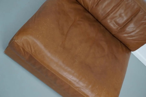 Image 1 of De Sede DS 76 loungestoel / slaapbank van cognackleurig leer, Zwitserland, jaren 1970
