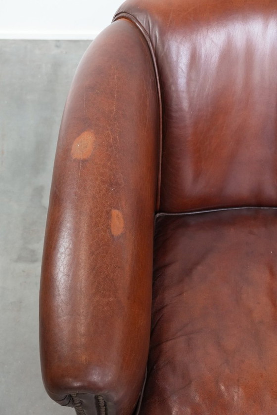 Image 1 of 2 x Vintage schapenleren clubfauteuil met siernagels 