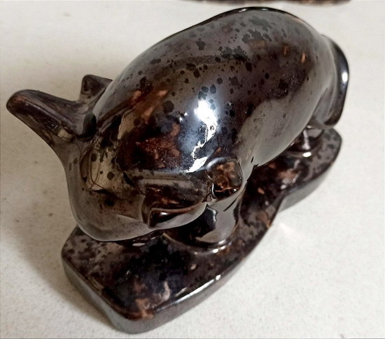 Image 1 of Een paar boekensteunen uit de jaren 60 met een gestileerd stierenontwerp.