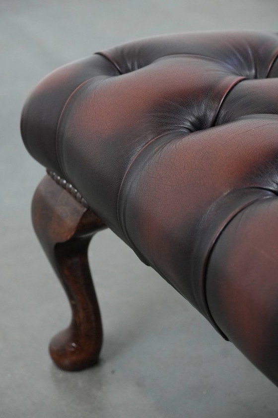 Image 1 of Dark brown Chesterfield footstool made of cowhide