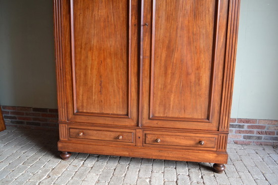 Image 1 of Sleek antique mahogany cabinet.