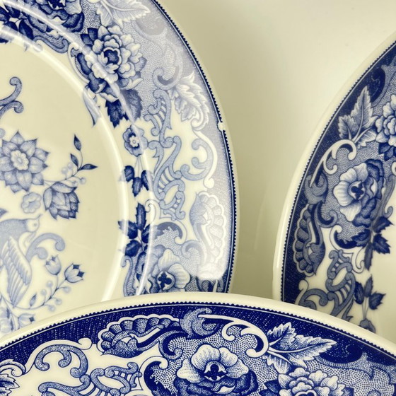 Image 1 of Set of 8 blue earthenware dinner plates with floral and bird decoration, early 20th century
