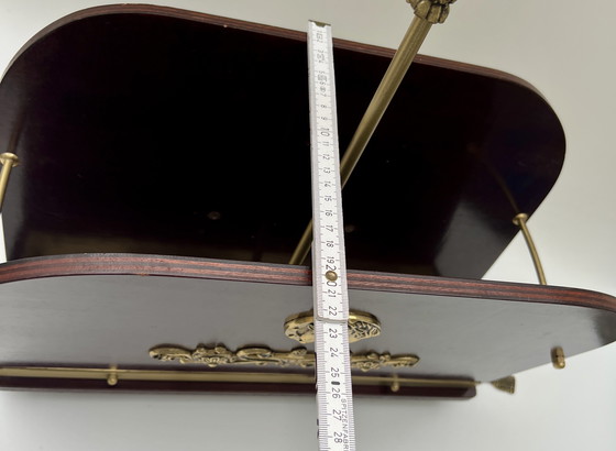 Image 1 of Portariviste decorativo in stile Impero – legno e ottone, piedini girevoli con nappe