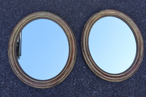 Image 1 of Pair of oval Louis Philippe period mirrors in giltwood