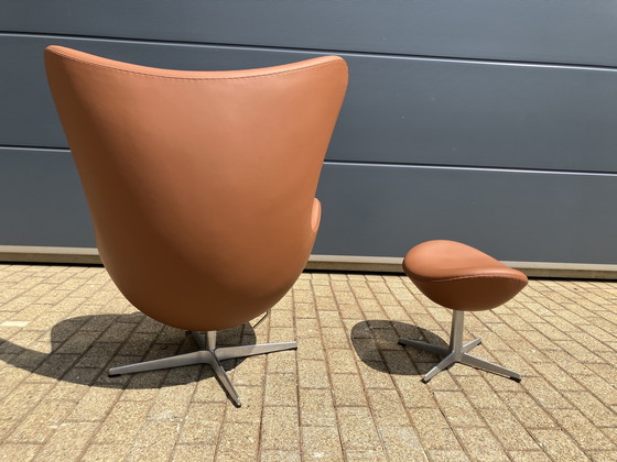 Image 1 of 2x Fritz Hansen Egg Chair + Ottoman en cuir Cognac NEUF !!!