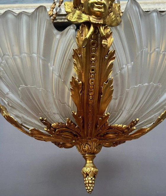 Gouden bronzen kroonluchter in Lodewijk XVI-stijl. 12 lichtpunten. (photo 6 of 8)