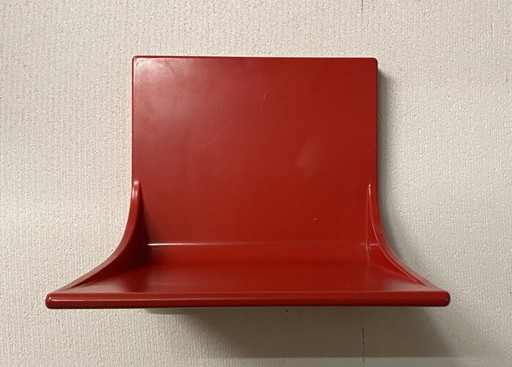 Red wall shelf unit by Rudolf Horn 1968