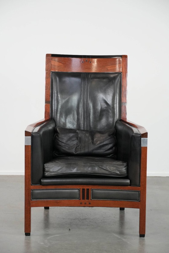 Image 1 of Black cowhide and wooden Art Deco design armchair by Schuitema from the Decoforma series with decorative cushion