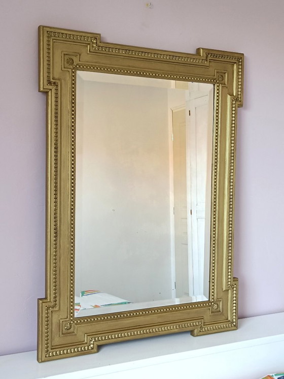 Image 1 of Large antique mirror in gilded wood and beveled glass