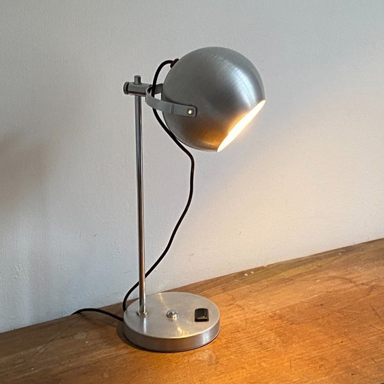Image 1 of Lampada a forma di globo oculare. 1970. Acciaio inossidabile spazzolato.