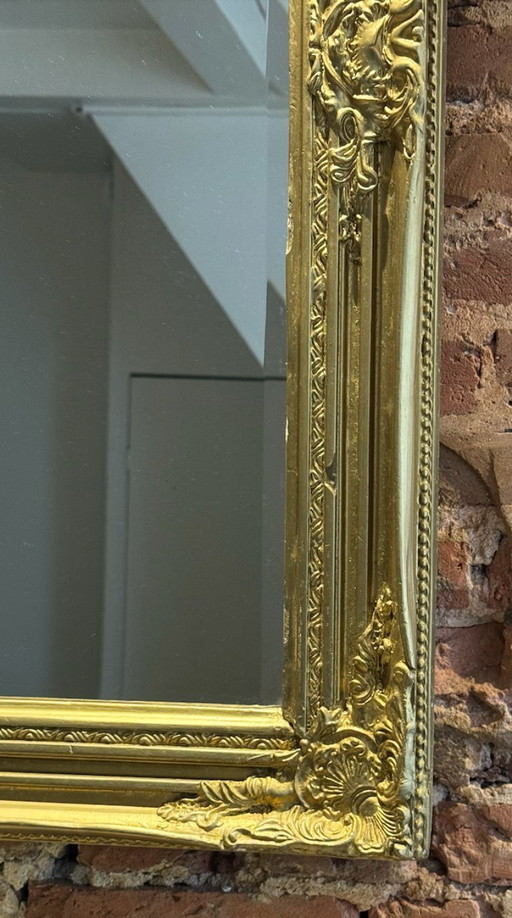 Large gold mirror with a baroque wood frame 
