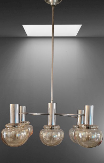 Experience the timeless elegance of the Mid Century Modern Atomic pendant lamp, attributed to Sciolari