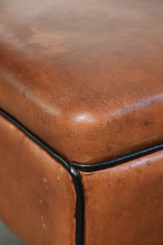 Versatile sheepskin leather footstool/pouf in a warm cognac color – Footstools & poufs, Klassiek (photo 8 of 10)