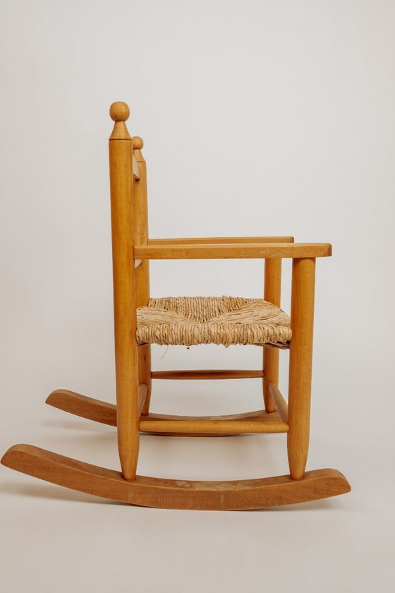 Image 1 of Vintage wooden children's rocking chair with rush seat