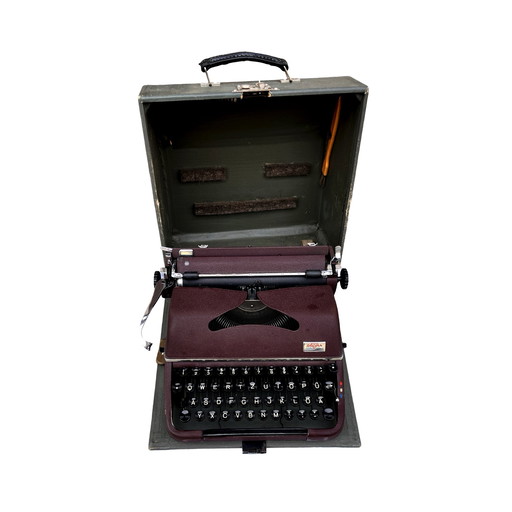 Burgundy Groma Model T Travel Typewriter, Germany, 1953.