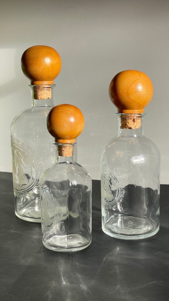 Image 1 of Vintage Engraved Glass and Wood Bottles