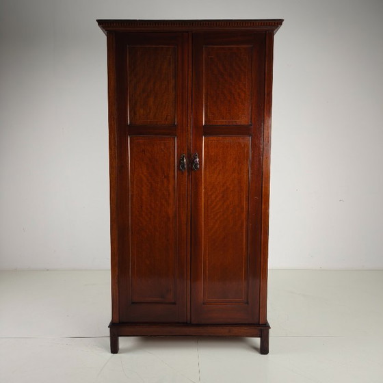 Image 1 of Men's clothing by Maple & Co. from the early 20th century.