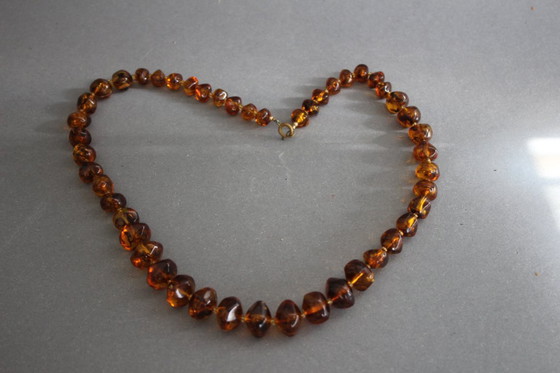 Image 1 of Vintage Bakelite/Catalin necklace in amber look with asymmetrical beads