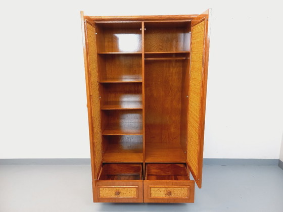 Image 1 of Armadio vintage Maugrion in rattan intrecciato e legno per Roche-Bobois, risalente agli anni '70.