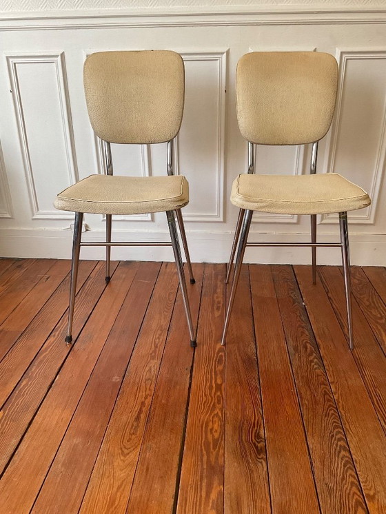 Image 1 of Een paar vintage stoelen uit de jaren 50 - gestempeld - verchroomd staal en gepatineerd kunstleer.