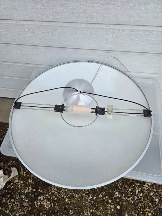 Image 1 of A striking design from 1996 by Luciano Balastrini for Luceplan, a large cutout of a sphere made of polycarbonate featuring a dia