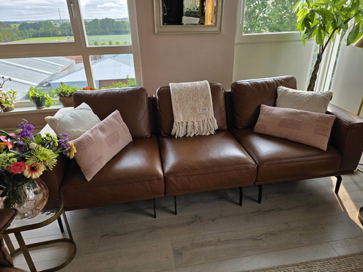Ledersofa mit Fußhocker