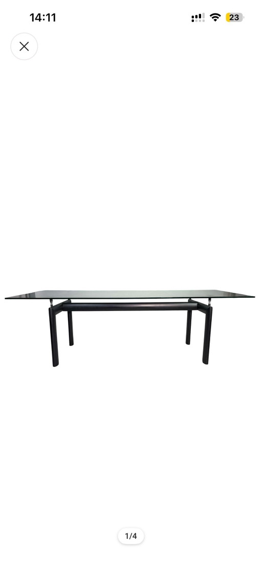 Modern and contemporary dining table, model LC6, glass top and black metal legs, Le Corbusier