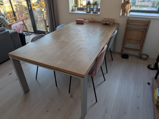 Solid glued wooden table with custom-made base