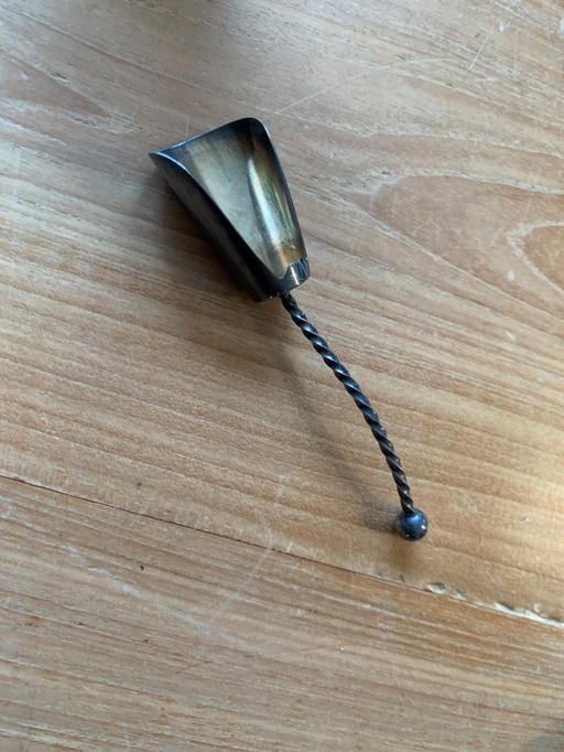 Cuchara para azúcar plateada