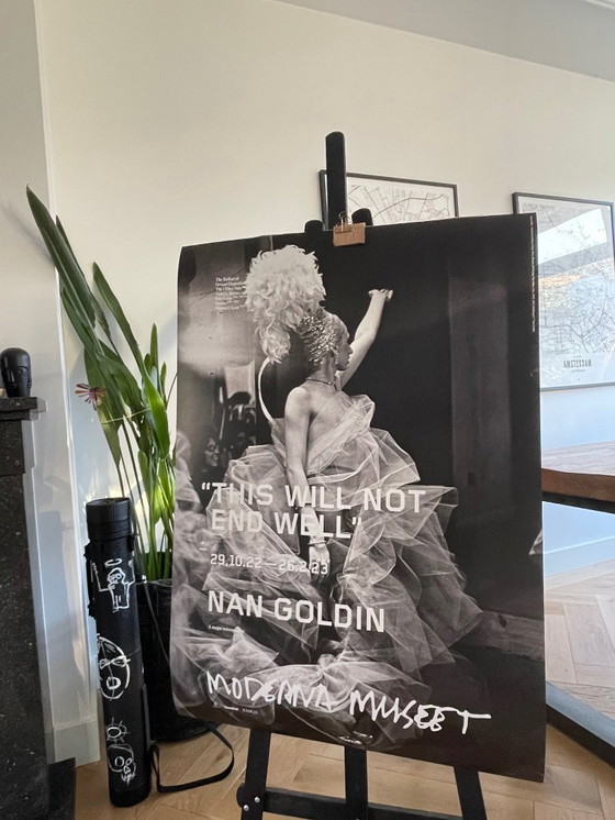 Image 1 of Nan Goldin, exibition poster  “This Will Not End Well” Naomi presenting a stage show, Boston (1973) fran The Other Side, 1992-20