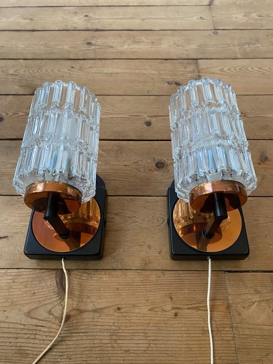 Image 1 of Een paar vintage koperen wandlampen van Phillips uit de jaren 70.